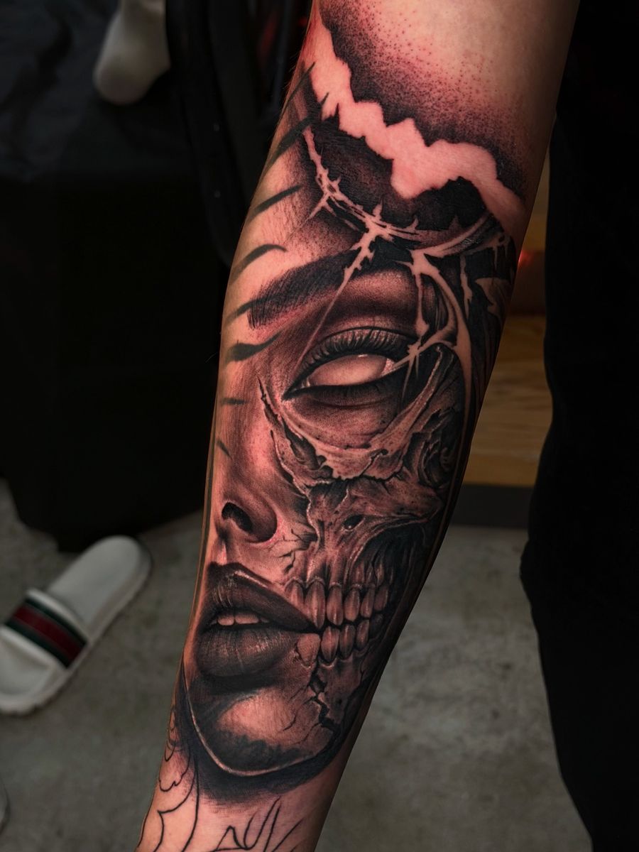 Black & grey realism forearm piece by Houston
